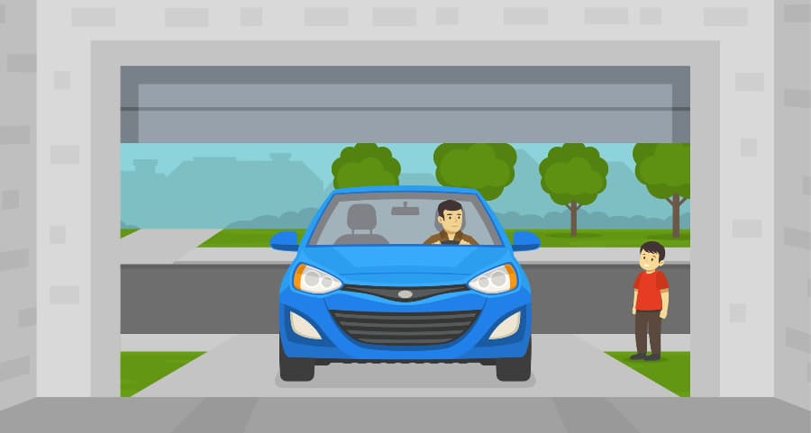 Image of a resident driving into the garage with a child looking on.